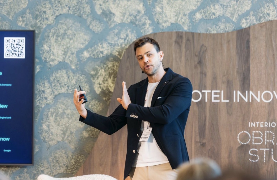 Adam Hamadache presenting at a hotel innovation event